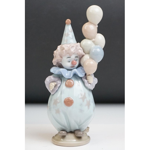 23 - Three Lladro porcelain clown figures to include 5813 ' Having A Ball ', 5279 ' Pierrot With Concerti... 