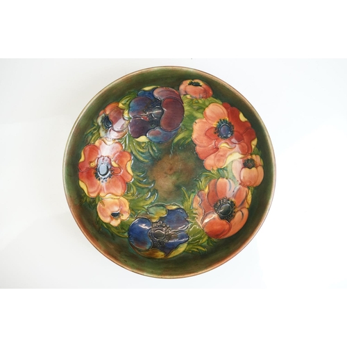 3 - William Moorcroft ' Anemone ' pattern fruit bowl on green/brown ground, impressed marks & paper labe... 