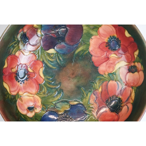 3 - William Moorcroft ' Anemone ' pattern fruit bowl on green/brown ground, impressed marks & paper labe... 