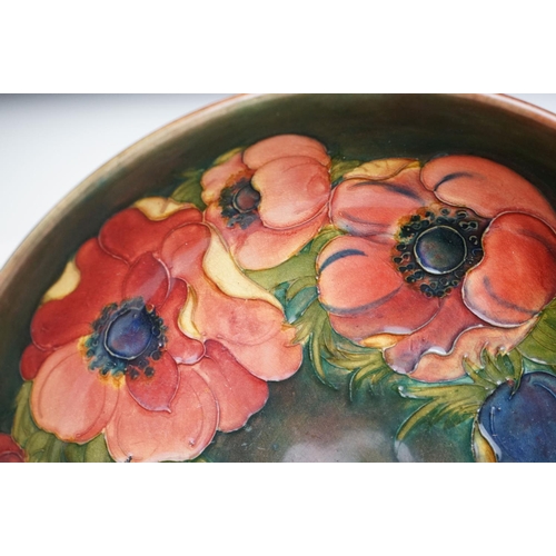 3 - William Moorcroft ' Anemone ' pattern fruit bowl on green/brown ground, impressed marks & paper labe... 