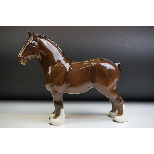 61 - Two Beswick porcelain shire horse figures in brown gloss (tallest measures 26.5cm high)