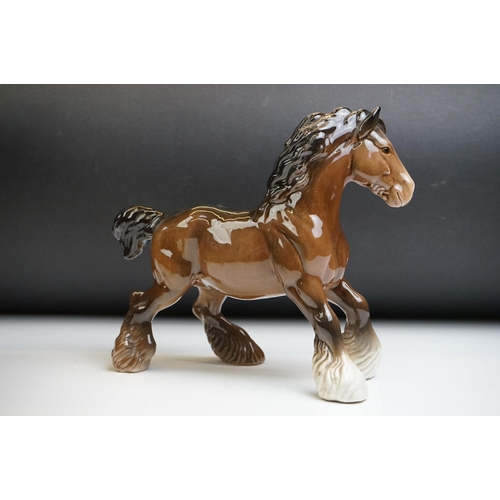 61 - Two Beswick porcelain shire horse figures in brown gloss (tallest measures 26.5cm high)