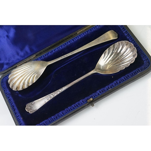 202 - A cased set of six hallmarked sterling silver tea spoons together with a cased pair of fully hallmar... 