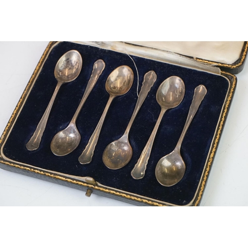 202 - A cased set of six hallmarked sterling silver tea spoons together with a cased pair of fully hallmar... 