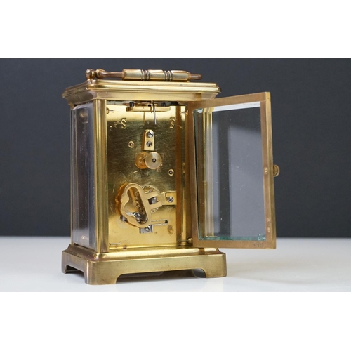 209 - A brass cased carriage clock with bevelled glass panels, the dial marked Hawley & Co of Regent St. L... 