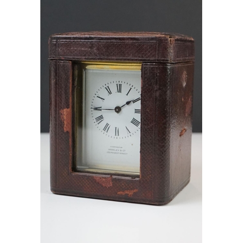 209 - A brass cased carriage clock with bevelled glass panels, the dial marked Hawley & Co of Regent St. L... 