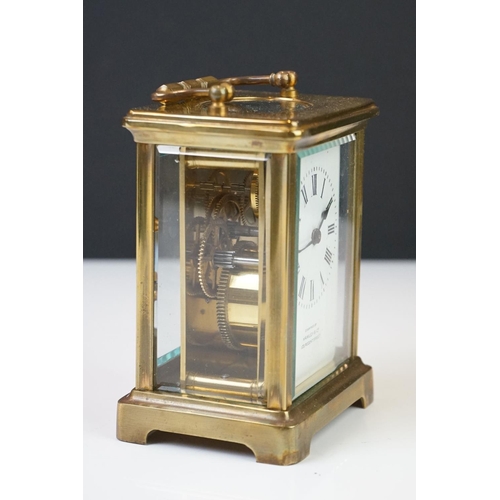 209 - A brass cased carriage clock with bevelled glass panels, the dial marked Hawley & Co of Regent St. L... 