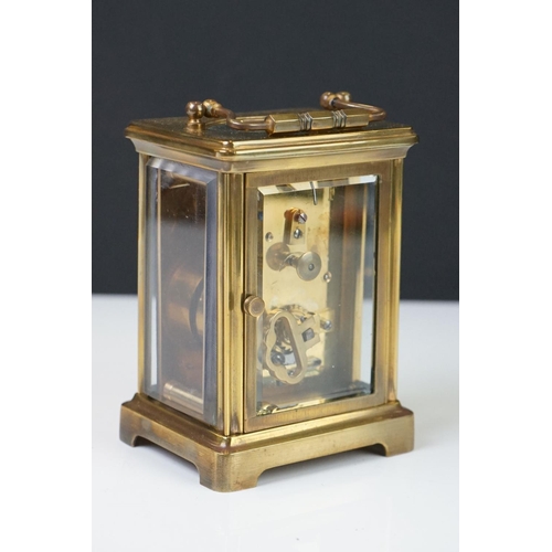 209 - A brass cased carriage clock with bevelled glass panels, the dial marked Hawley & Co of Regent St. L... 