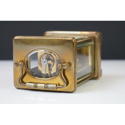 209 - A brass cased carriage clock with bevelled glass panels, the dial marked Hawley & Co of Regent St. L... 