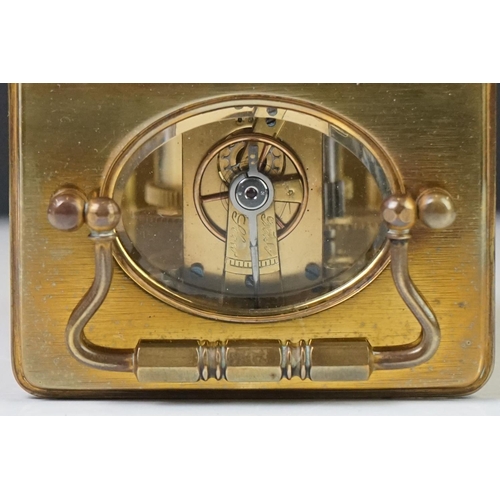 209 - A brass cased carriage clock with bevelled glass panels, the dial marked Hawley & Co of Regent St. L... 