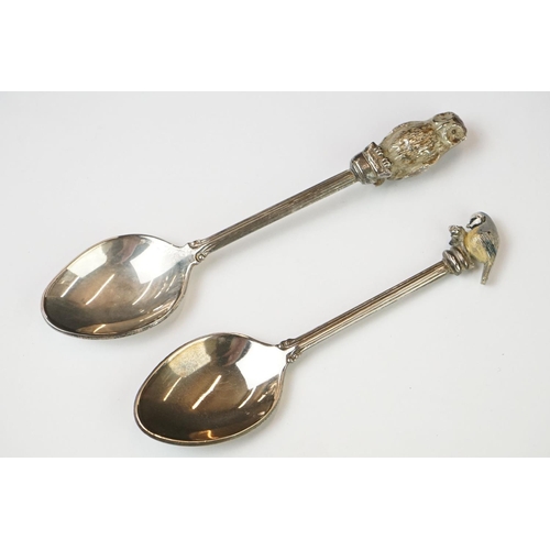 212 - A small collection of commemorative souvenir spoons together with a hallmarked silver and mother of ... 