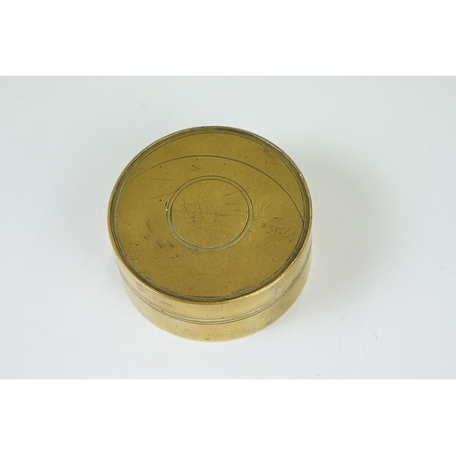 219 - A collection of five antique brass snuff or tobacco boxes to include a 19th century example, one ins... 