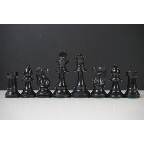 221 - Two vintage boxwood chess sets together with wooden chess board and two associated brushes.