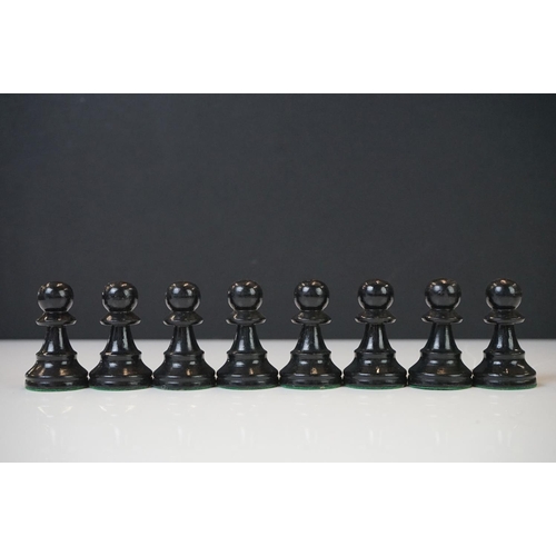 221 - Two vintage boxwood chess sets together with wooden chess board and two associated brushes.