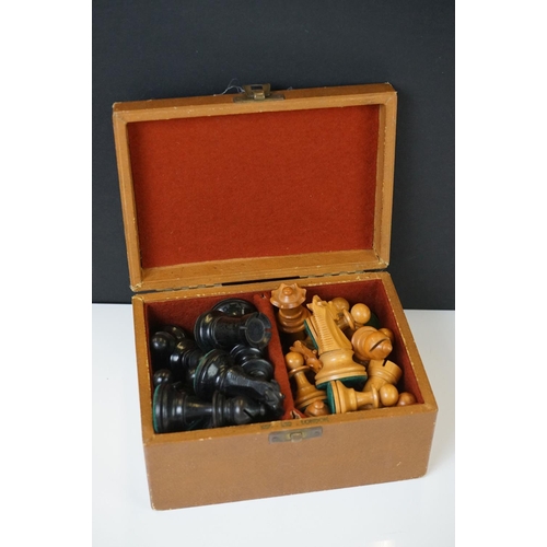 221 - Two vintage boxwood chess sets together with wooden chess board and two associated brushes.