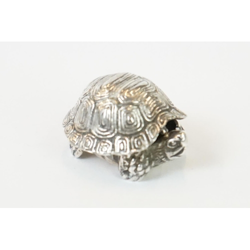 271 - A hallmarked sterling silver pill box in the form of a tortoise together with a silver pill box in t... 