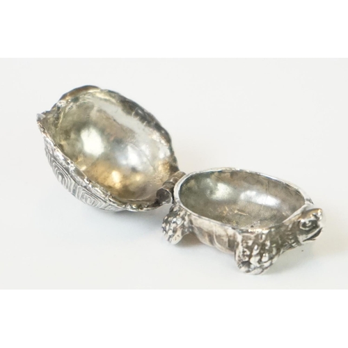 271 - A hallmarked sterling silver pill box in the form of a tortoise together with a silver pill box in t... 