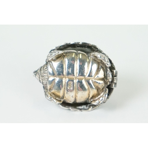 271 - A hallmarked sterling silver pill box in the form of a tortoise together with a silver pill box in t... 