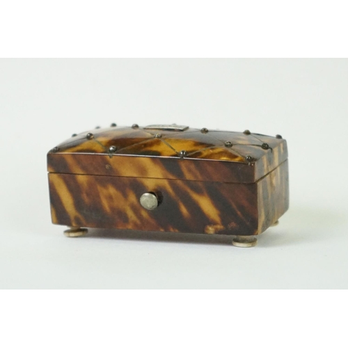 275 - An antique faux tortoiseshell trinket box with central cartouche to the hinged lid and turned bone f... 