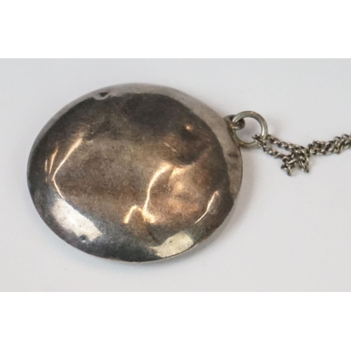 278A - A fully hallmarked sterling silver pill box on a white metal necklace, assay marked for Chester and ... 