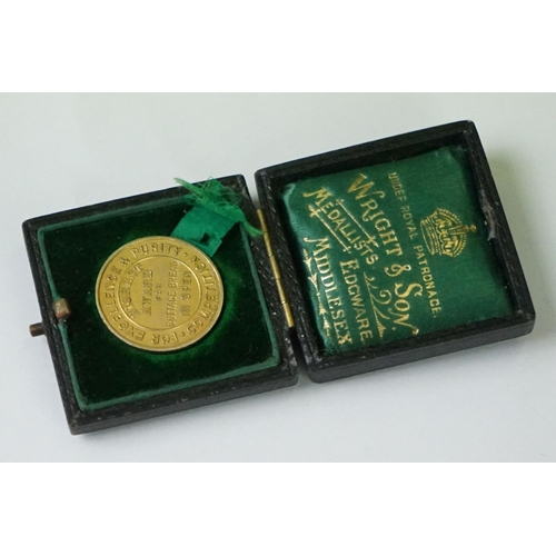 282 - A cased hallmarked 9ct gold medal for excellence and purity together with a cased silver Hovis bread... 