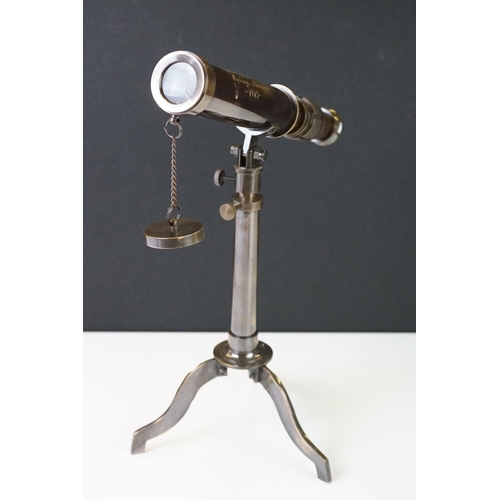 286 - Brass cased telescope on tripod stand