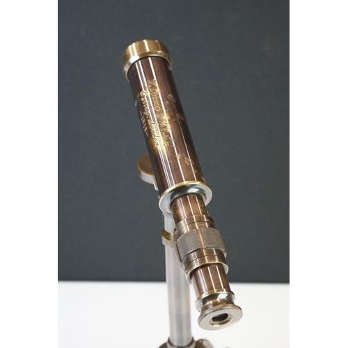 286 - Brass cased telescope on tripod stand