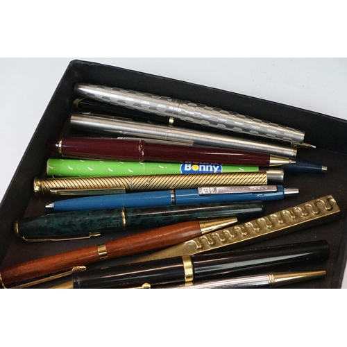 288 - A collection of mixed pens to include Parker fountain pens together with vintage money boxes and cos... 