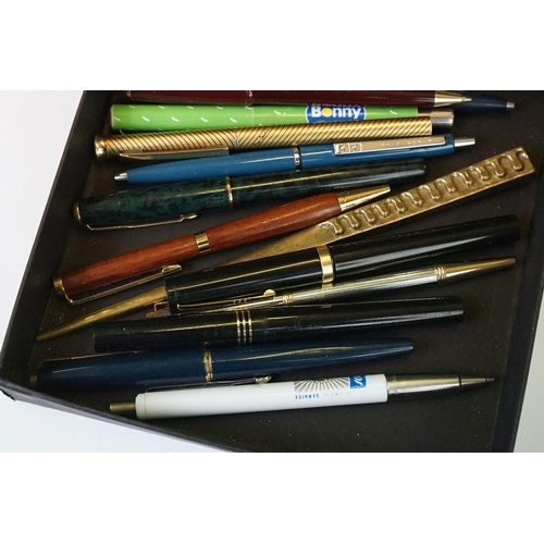 288 - A collection of mixed pens to include Parker fountain pens together with vintage money boxes and cos... 