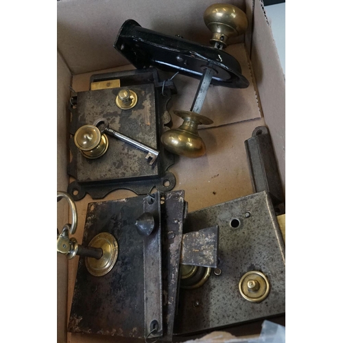 301 - A collection of vintage door furniture to include locks, knobs, handles...etc.