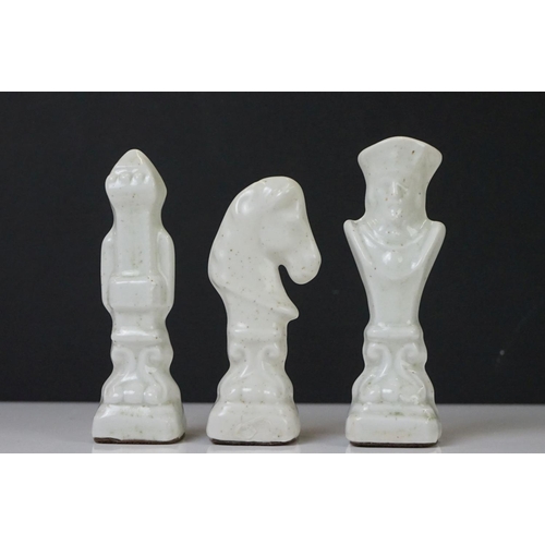 305 - A set of ceramic chess pieces together with wooden chess board.