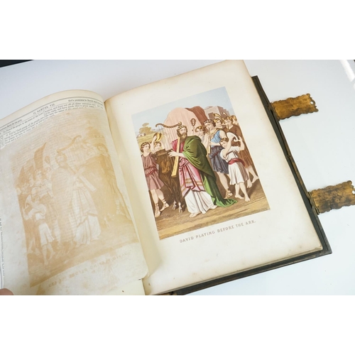 311 - A large antique 19th century family bible with brass fastenings.