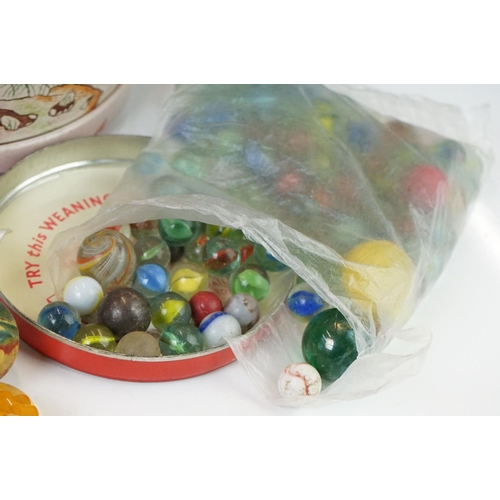 328 - A collection of vintage marbles contained within three boxes.