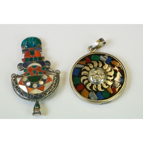 337 - A collection of 925 sterling silver Mexican / Peruvian pendants and brooches.