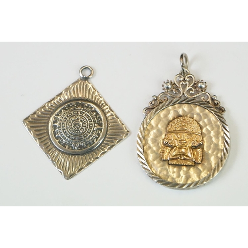 337 - A collection of 925 sterling silver Mexican / Peruvian pendants and brooches.