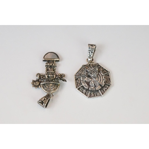 337 - A collection of 925 sterling silver Mexican / Peruvian pendants and brooches.