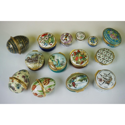 338 - A collection of approx fourteen enamel trinket boxes to include Halcyon Days examples.