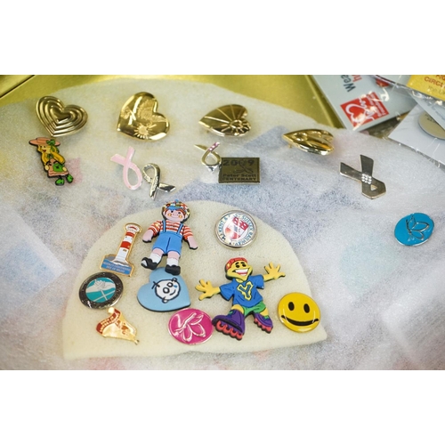 341 - A group of mixed collectables to include a large quantity of mixed pin badges and a small group of c... 