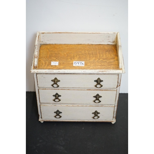 597A - Victorian oak tabletop painted three drawer chest, 32cm wide x 35cm high