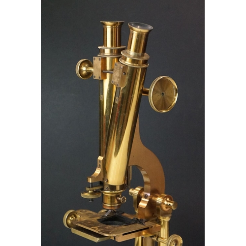 186 - A mahogany cased microscope by J.B. Dancer of Manchester with extra lenses, slides...etc.