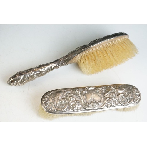 310 - A box of mixed collectables to include dressing table brushes and mirrors to include silver example,... 