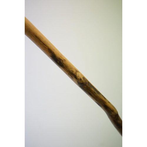 392 - A vintage hand carved walking stick with figural head handle.