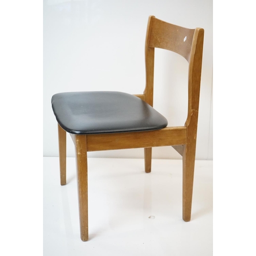 555 - Set of Four Mid century Retro Teak Dining Chairs with black vinyl seats