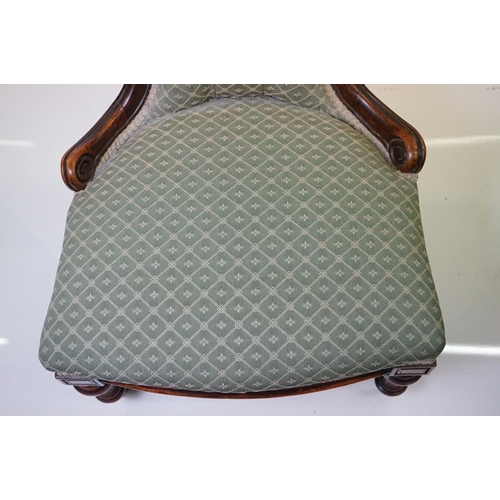 559 - Victorian Walnut Nursing Chair with waisted back, green button back upholstery, raised on turned fro... 