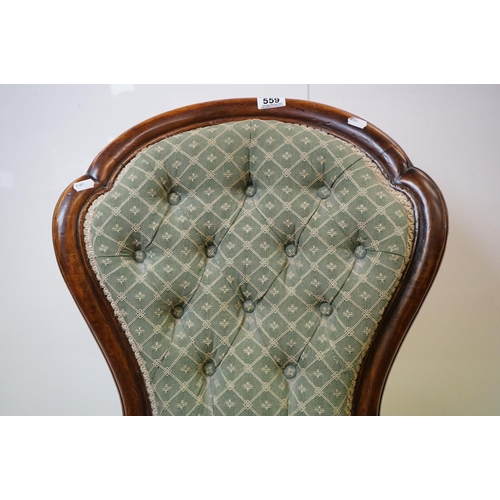 559 - Victorian Walnut Nursing Chair with waisted back, green button back upholstery, raised on turned fro... 