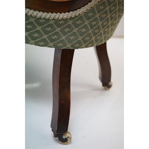 559 - Victorian Walnut Nursing Chair with waisted back, green button back upholstery, raised on turned fro... 