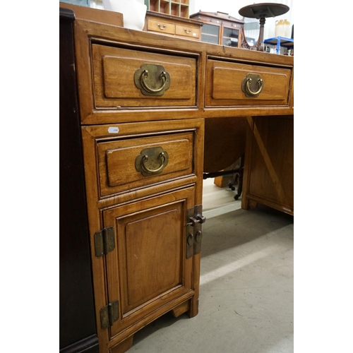 576 - Chinese Hardwood Twin Pedestal Desk of concave form comprising an arrangement of six drawers and two... 