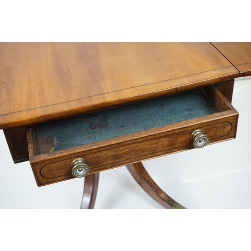 588 - Regency Mahogany Drop Flap Breakfast Table, two drawers to either end,  raised on quadruped swept su... 