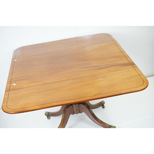 588 - Regency Mahogany Drop Flap Breakfast Table, two drawers to either end,  raised on quadruped swept su... 