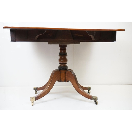 588 - Regency Mahogany Drop Flap Breakfast Table, two drawers to either end,  raised on quadruped swept su... 